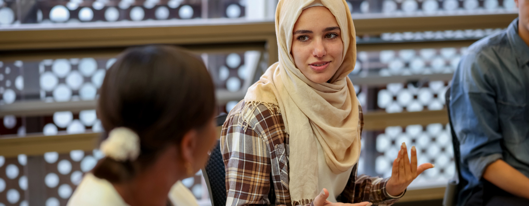 UFG-Blog-WomanWearingHijab-1695x661 A female employee participates in a multicultural ERG group.
